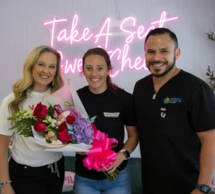 A picture with the owners and a women