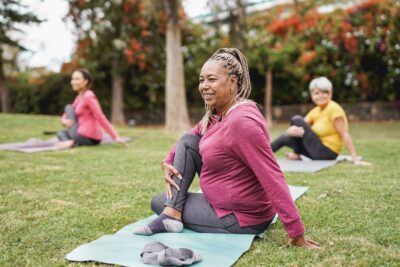 Three people doing yoga